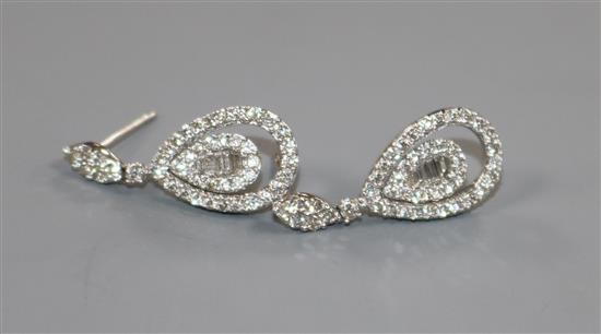 A modern pair of 18ct white gold and diamond set pear shaped drop earrings, overall 27mm.